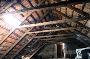 attic ceiling with exposed insulation. 